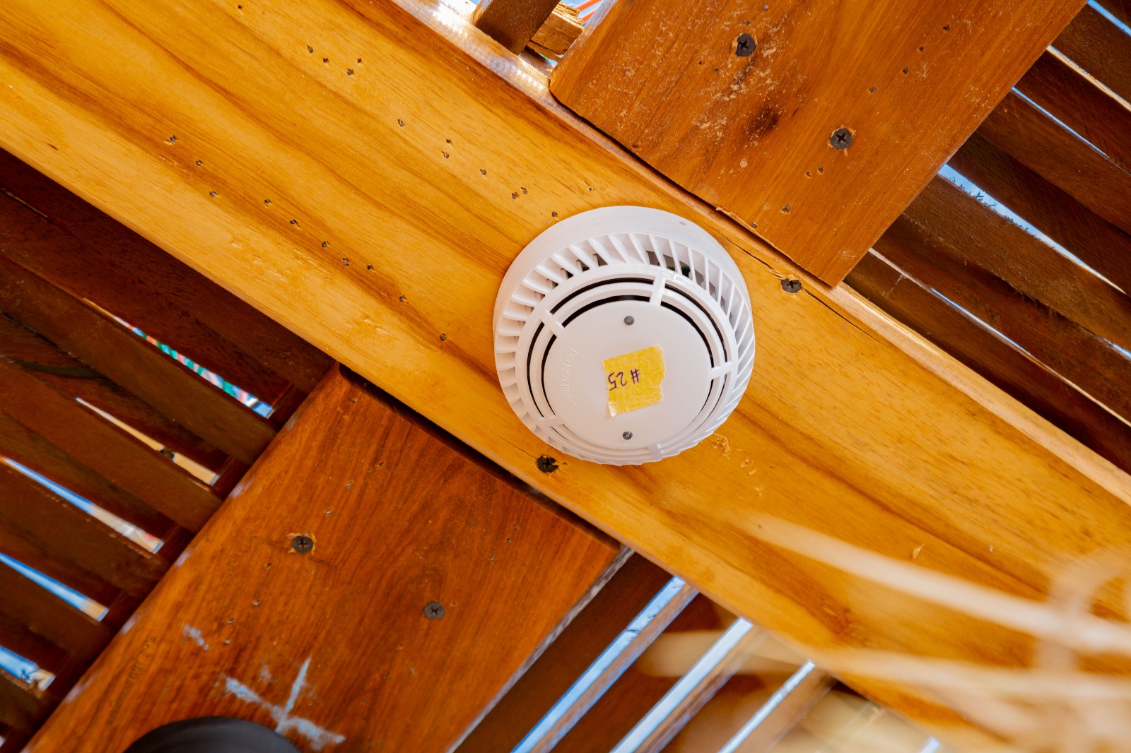 Fire detector installed on a timber ceiling